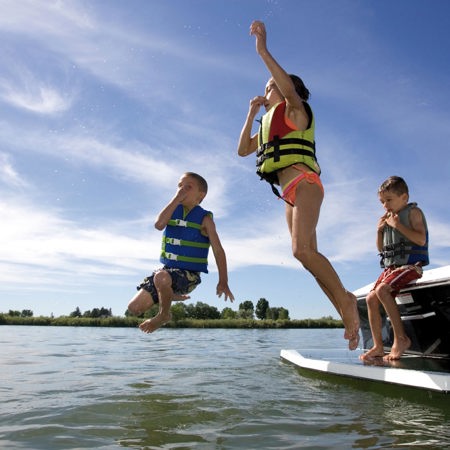 Children Jumping Into Water