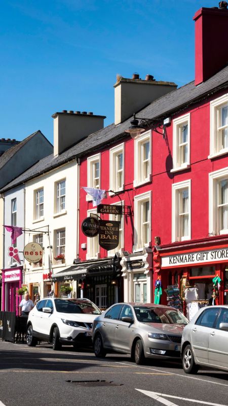 Kenmare town centre with its brightly painted buildings, including the "Kenmare Gift Store"