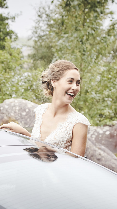 Bride getting into a car